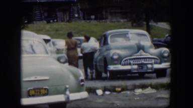 1951: two people walking across a parking lot WYOMING