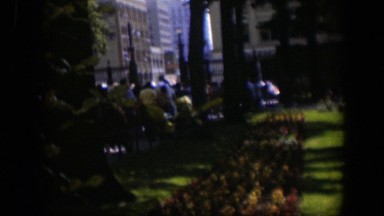 1951: people outside on grass in a large group enjoying each others company