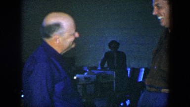 1952: two men talking and laughing with a woman in the scene HOUSTON TEXAS