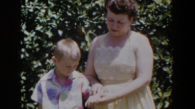 1953: mother and son posing for a photo together. LUBBOCK TEXAS