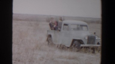 1956: pickup truck full of people stops to pick someone up LUBBOCK TEXAS