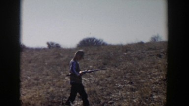 1957: A Man Walking in the Desert with a Gun Lubbock Texas