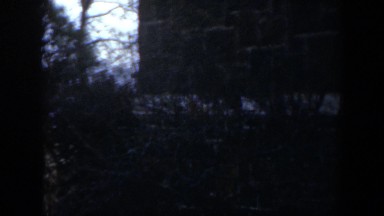 1951: A White Brick Line Running Through the Middle of a Wall with Two People
