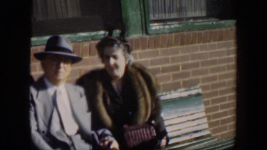 1951: Elder Man and Woman Sitting on Park Bench in Cuba
