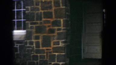 1951: Little Children Exiting a Door in Cuba
