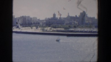 1951: city surrounded by a large body of water with structures