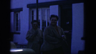 1951: two women walking in front of a building TEXAS