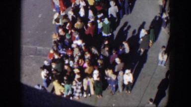 1951: large crowd all standing together out on the street. TEXAS