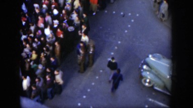 1951: many people gathered in the street to watch an event taking place TEXAS