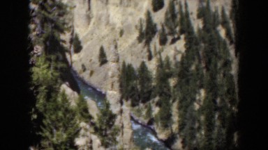 1951: aerial view of trees in a congested area that has water and dirt WYOMING