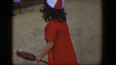 1954: little girl running and skipping around outside. LAS VEGAS NEVADA
