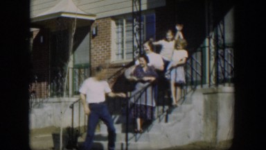 1954: a happy, smiling family sending the father off to his first day on the new