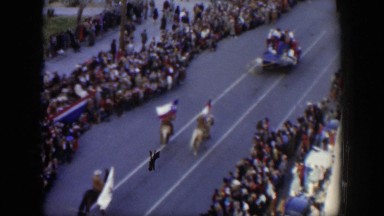1951: Hundreds of People Line the Street as a Parade Passes by in Texas