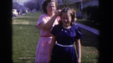 1954: mother fixing daughter's hair LAS VEGAS NEVADA