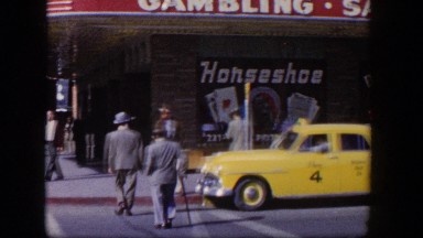 1954: people walking down the street next to a gambling establishment LAS VEGAS