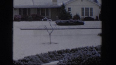 1954: snowy scene in front of a house. NEVADA
