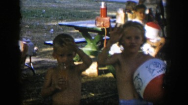 1954: little kids waving at the camera. NEVADA