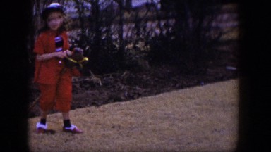 1954: giddyup! girl rides her pony stick around the yard. LAS VEGAS NEVADA