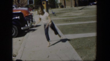 1954: girl outside on the sidewalk dancing. NEVADA