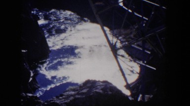 1954: a building that is built into the side of the mountain with a valley