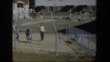 1954: Two Girls Having Fun on Swing Set at Nevada Playground