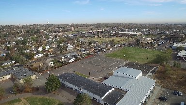 aerial view of a neighborhood with many buildings and roofs COLORADO