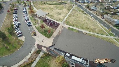Colorado, United States: Aerial View of a Business with a Gathering of People Near the Parking Lot