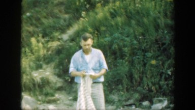 1947: Family Enjoying Outdoors at Campsite with Vegetation