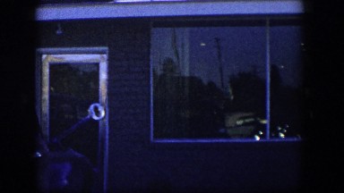 1954: View from Outside a Classic Nevada Home with Brick Facade and Columns