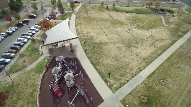 aerial view of roads and nature along with lots of vehicles showing the