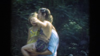 1947: Father with Daughters Cute Scene Holding and Walking Mother Drying Up