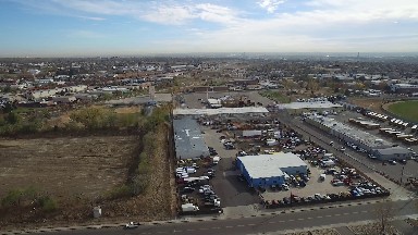 overlook of buildings and streets with various structures and vegetation around