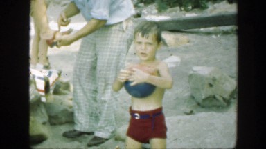 1947: family enjoying time together outdoors and playing with each other
