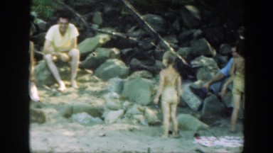 1947: family having a relaxing day out by the lake. CONNECTICUT