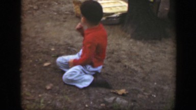 1949: cute child outside stands up and poses in a forest area MASSACHUSETTS
