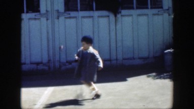 1949: a small boy kicking a ball around in the driveway MASSACHUSETTS