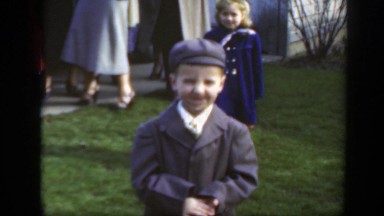 1949: a boy wearing a coat and hat while shaking his head no MASSACHUSETTS