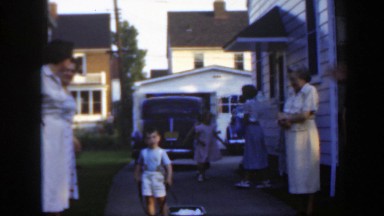 1949: boy pushes wagon around family MASSACHUSETTS