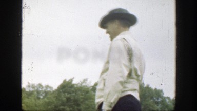 1949: a family is playing ball at a recreational area laughing and smiling