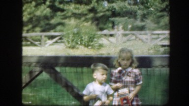 1948: little boy and girl eating crackers on a bridge. WASHINGTON DC