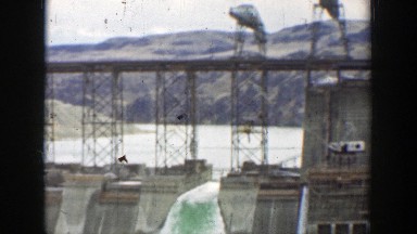 1937: A Dam Gushing Water Over Its Walls in California