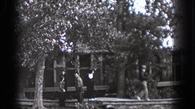 1938: people walking around outside, quietly. WASHINGTON