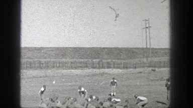 1938: people outside playing football. WASHINGTON