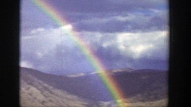 1939: Beautiful full rainbow in a canyon