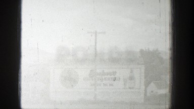 1939: small town with a large sign and small houses in the background WYOMING