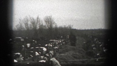 1939: farmer is feeding his cattle, while another rides horseback on the farm
