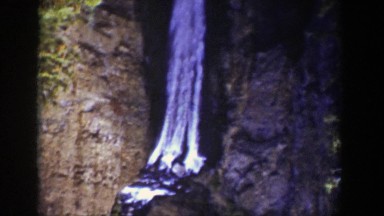 1939: upside down waterfall splashing into the bedrock below. WYOMING