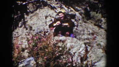1939: person walking around outside near a body of water. WYOMING