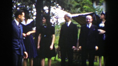1939: a group of people dressed nice gathered outside WYOMING