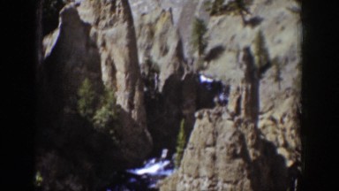 1939: a waterfall on the side of a rocky mountain WYOMING